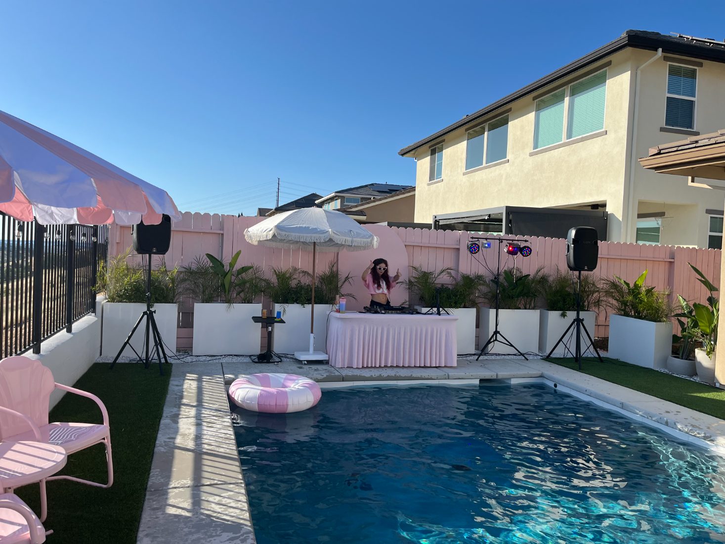 DJ Bunz playing a pink poolside day party