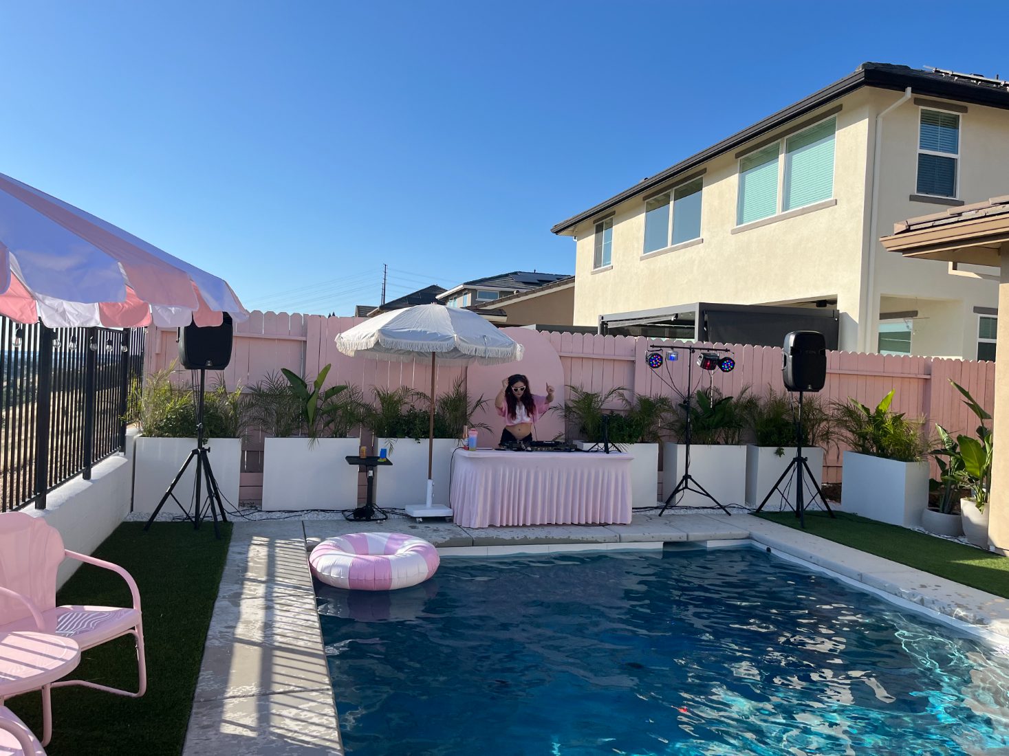 DJ Bunz hyping the crowd at a poolside set